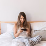 streaming-concept-with-woman-bed_23-2147993526